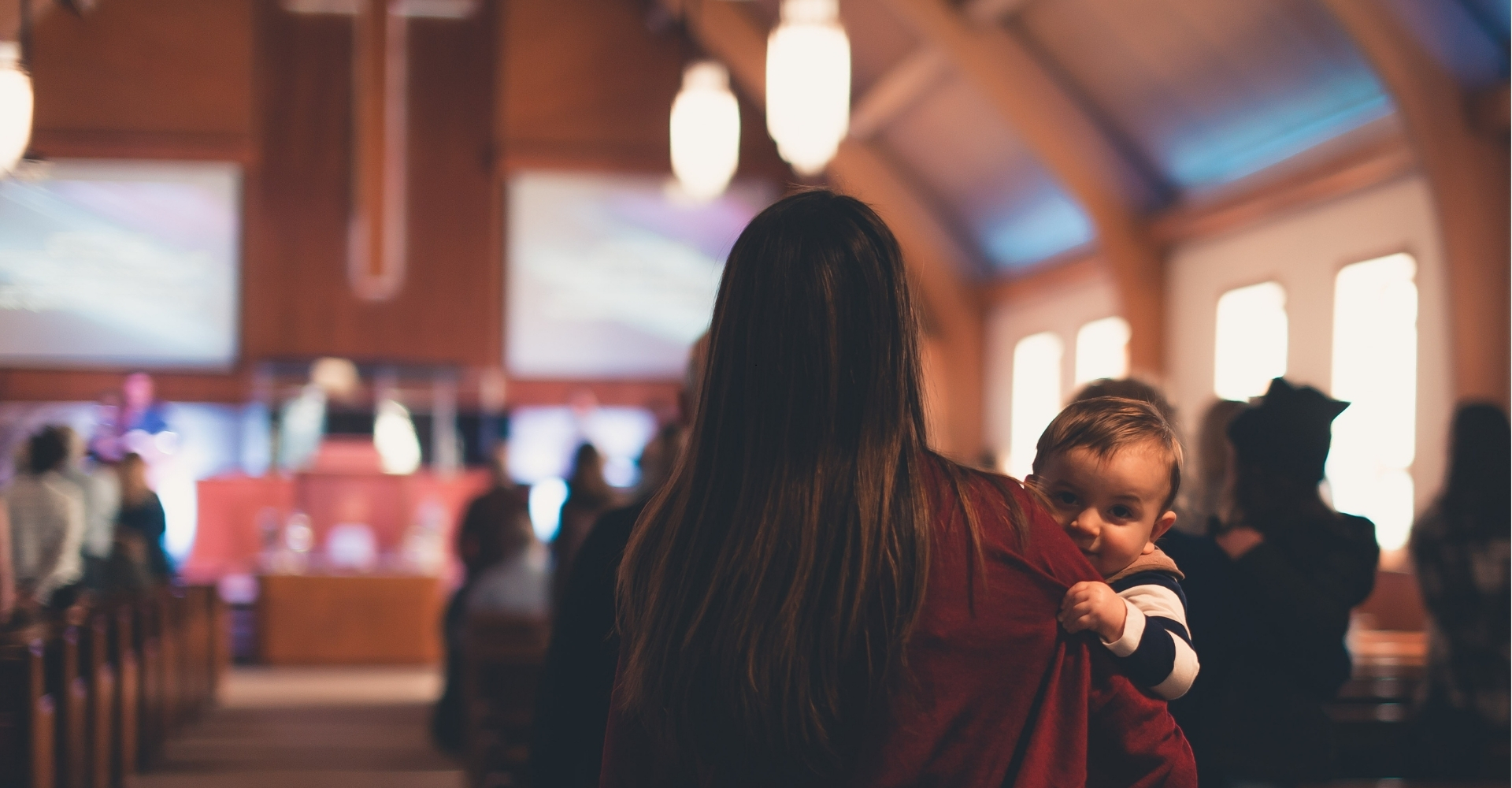 man holding his hands on open book